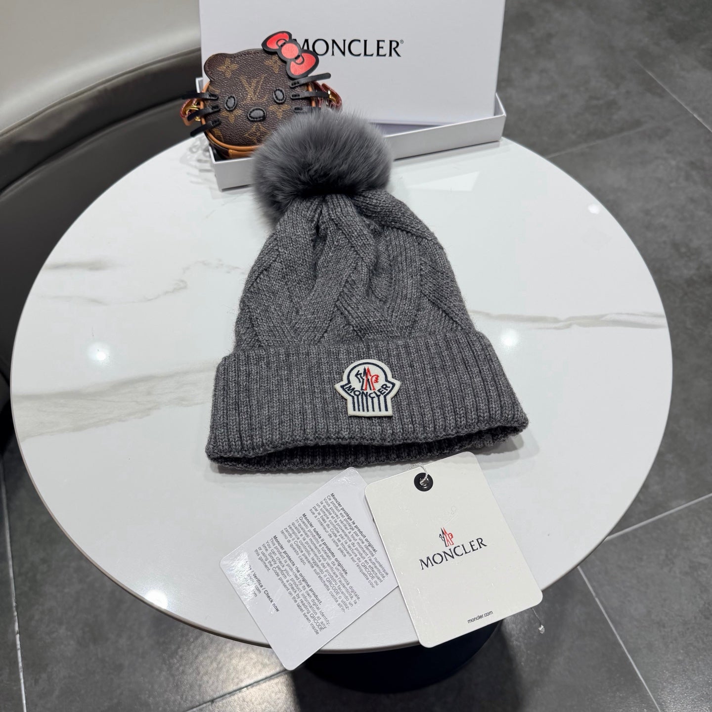 Moncler Wool Hat With Pom-pom 435188