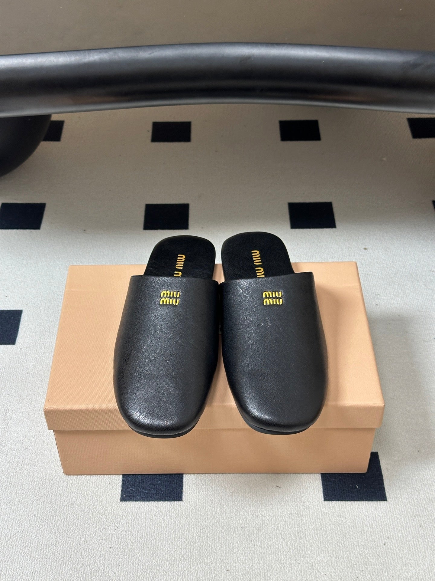 Miu Miu 2026 Flat Closed-Toe Mule Black Cowhide 994104